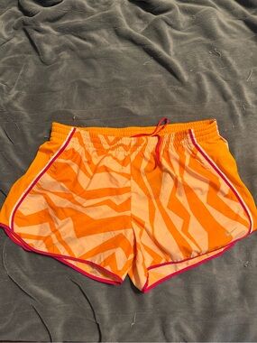 Nike Women's Orange Zebra-Pattern Athletic Shorts with Pink Trim